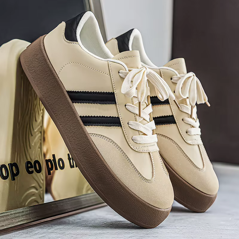 Chaussures de sport rétro à semelle épaisse noires et blanches unisexes pour hommes. Semelle en caou