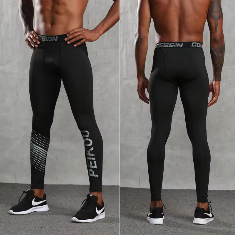 Pantalons serrés de sport de basket-ball